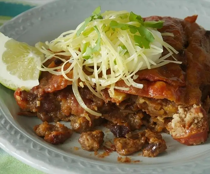 Garnished with chili flakes, the spicy taco meatloaf is served with a fiery salsa and melted pepper jack cheese and jalapeño slices.