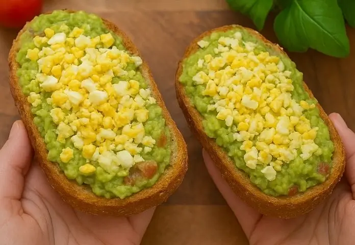 High protein sandwich with grilled chicken, fresh vegetables, and whole grain bread on a rustic wooden board